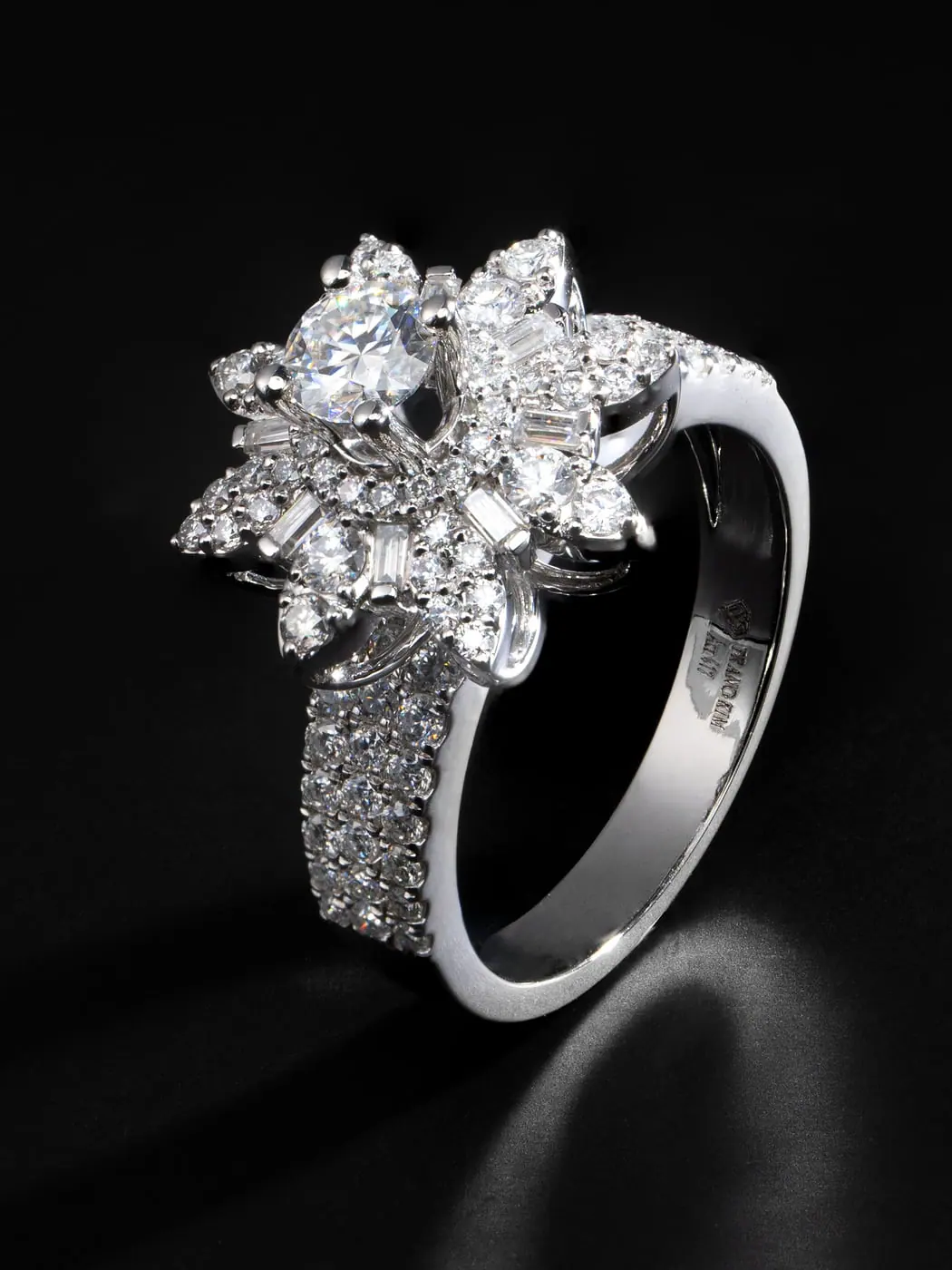 White-gold diamond cocktail ring with a marquise flower cluster on black